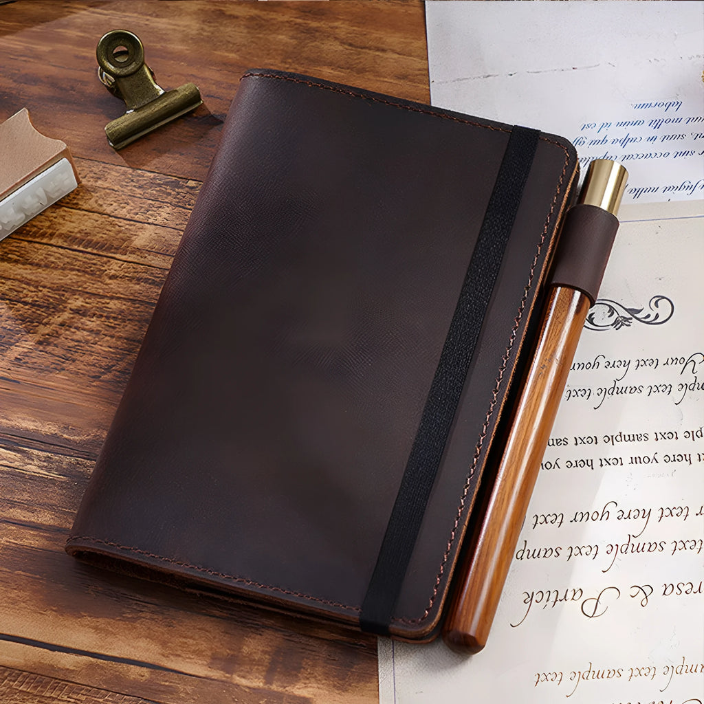 Handmade kraft notebook with cowhide cover showing dark green colour and 9x14cm wood-free paper pages