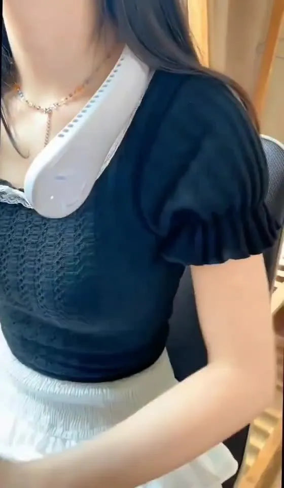 White USB rechargeable bladeless neck fan with flexible neckband worn for personal cooling.