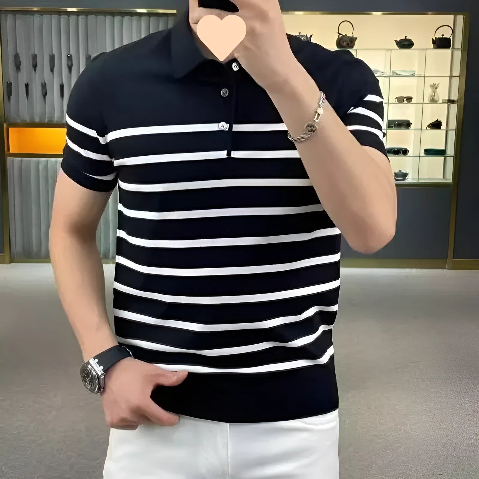 Men's black and white striped lapel V-neck long sleeve knitted T-shirt on a hanger.