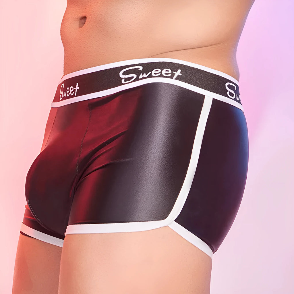 Men's silky shiny boxer shorts in black, white and sapphire blue colours on hanger