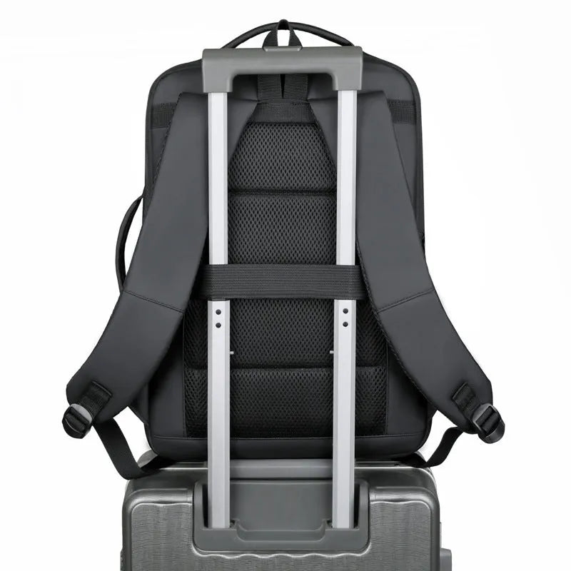Black or grey large waterproof oxford cloth backpack with curved shoulder straps.