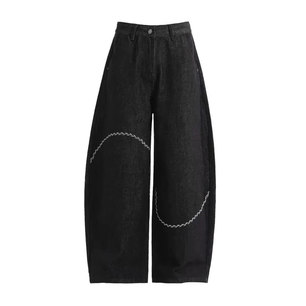 Black straight-leg denim trousers with micro-elastic waist and zip fly closure