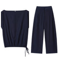 Women's linen blend wide-leg trouser and flounced sleeve top co-ord suit set in a professional style.