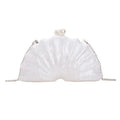 Acrylic shell-shaped clutch bag in champagne with silver chain on white background