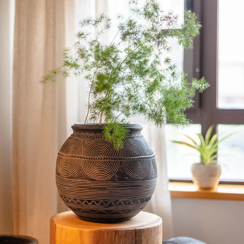 African art cement flower pot with textured finish and drainage holes for indoor outdoor plants