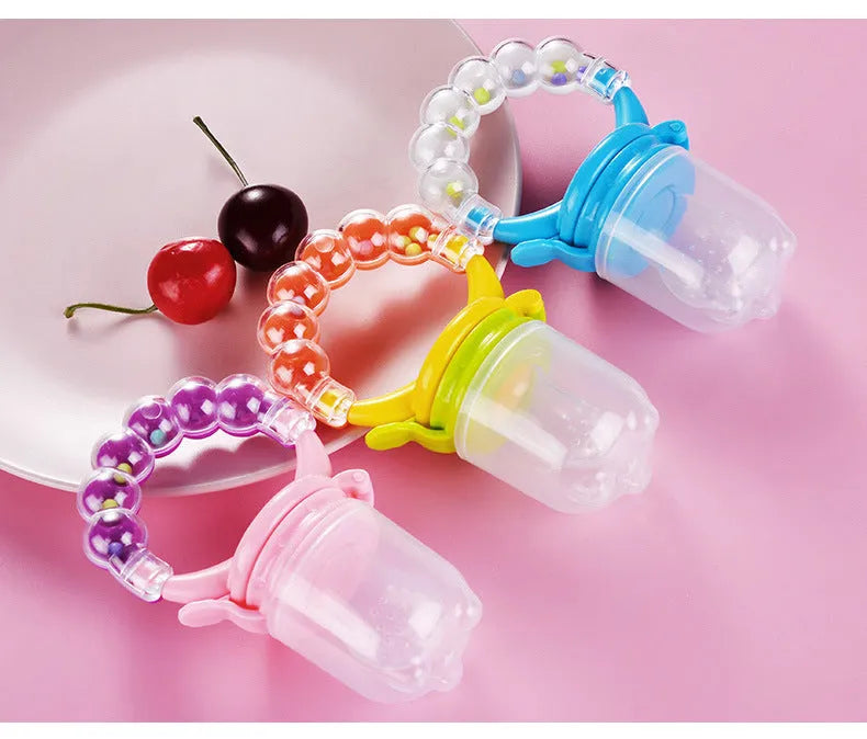Baby fruit feeder with silicone mesh bag in blue and green colours on white background