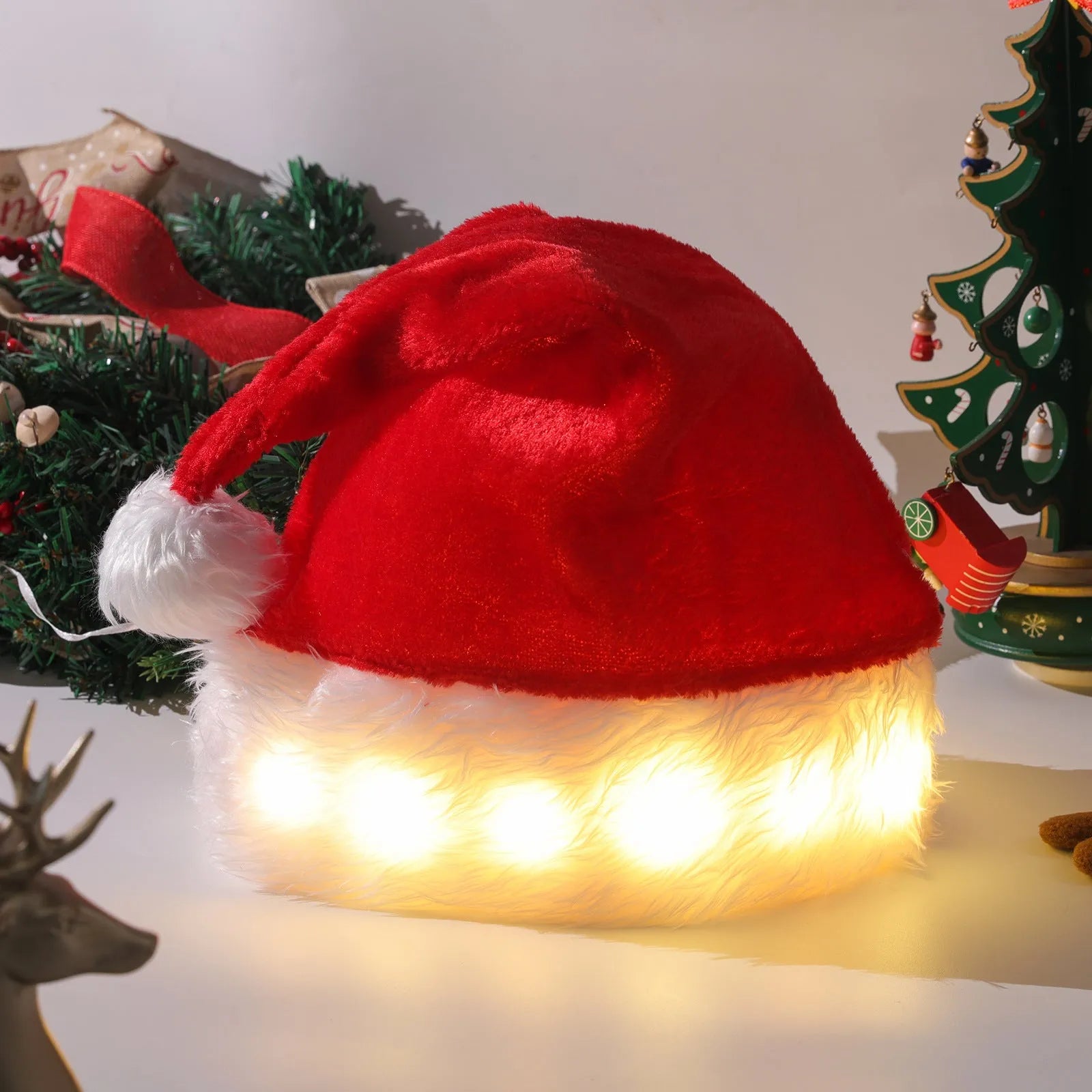 Red and white plush Santa hat with colour-changing LED lights and pom-pom detail