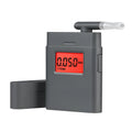 At-838 black handheld alcohol detector breathalyzer with display and mouthpiece on a white background