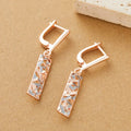 Rectangular two-tone hollow stud earrings with electroplated finish and geometric design