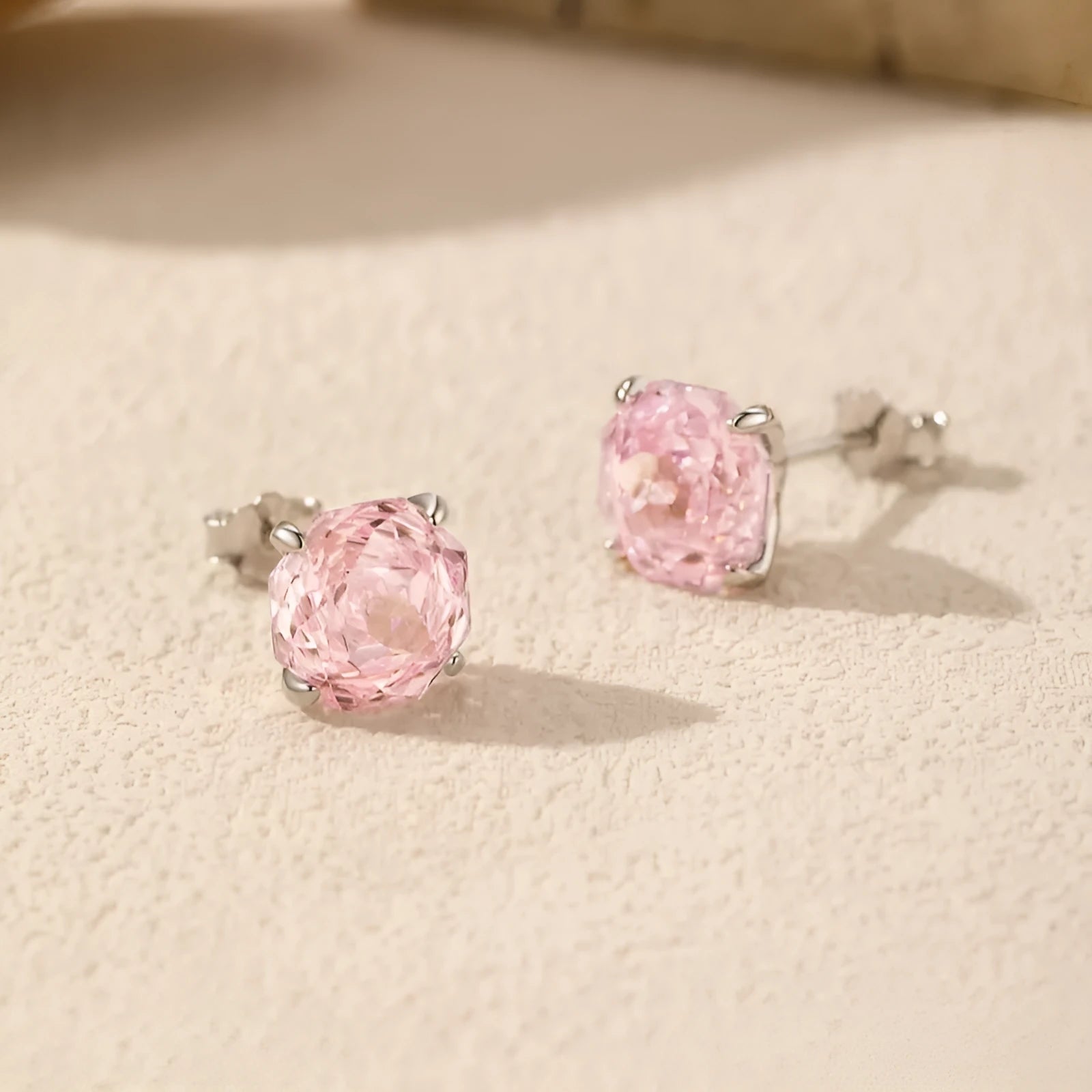 A pair of S925 sterling silver rose stud earrings for women, shown in 6mm and 8mm sizes.
