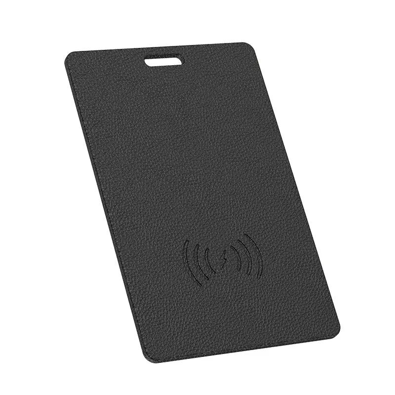 iOS card tracker in black with wireless charger, showing compact 80x53x3.8mm size against a keychain