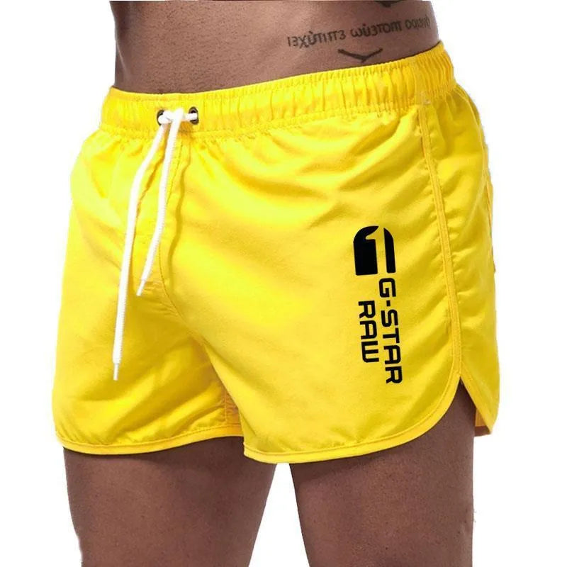 Men's thin polyester sports shorts in various colours with an elasticated waistband.