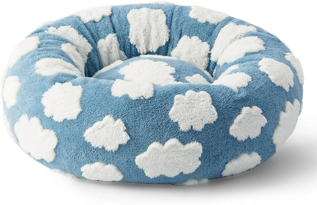 Round plaid dog bed with raised sides on a plastic base, shown in a sea blue and white colour.