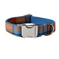 Blue plaid cotton dog collar with silver alloy buckle on a white surface