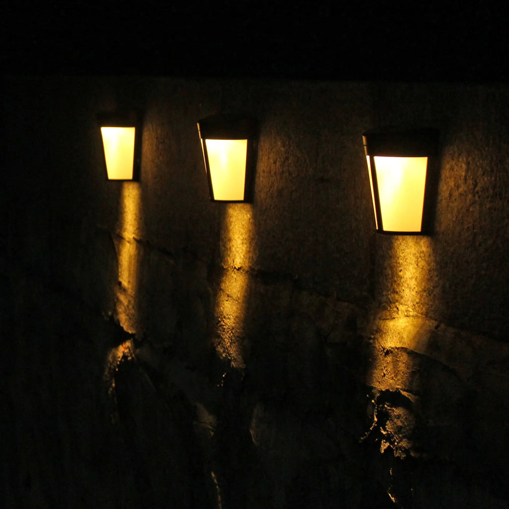Solar-powered outdoor wall lamp with 6 LEDs and IP65 waterproof rating for garden lighting