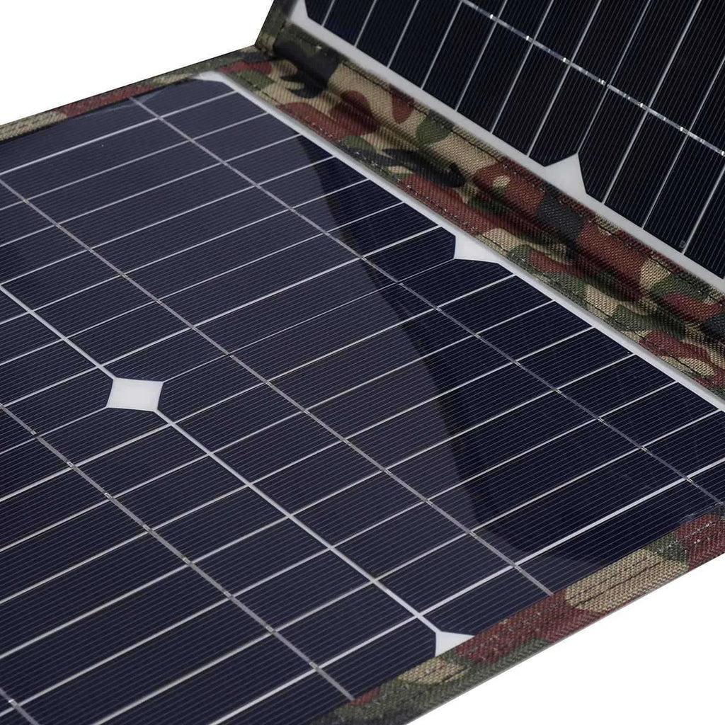 Black foldable portable solar panel unfolded showing three solar cells, with car charger and cables.