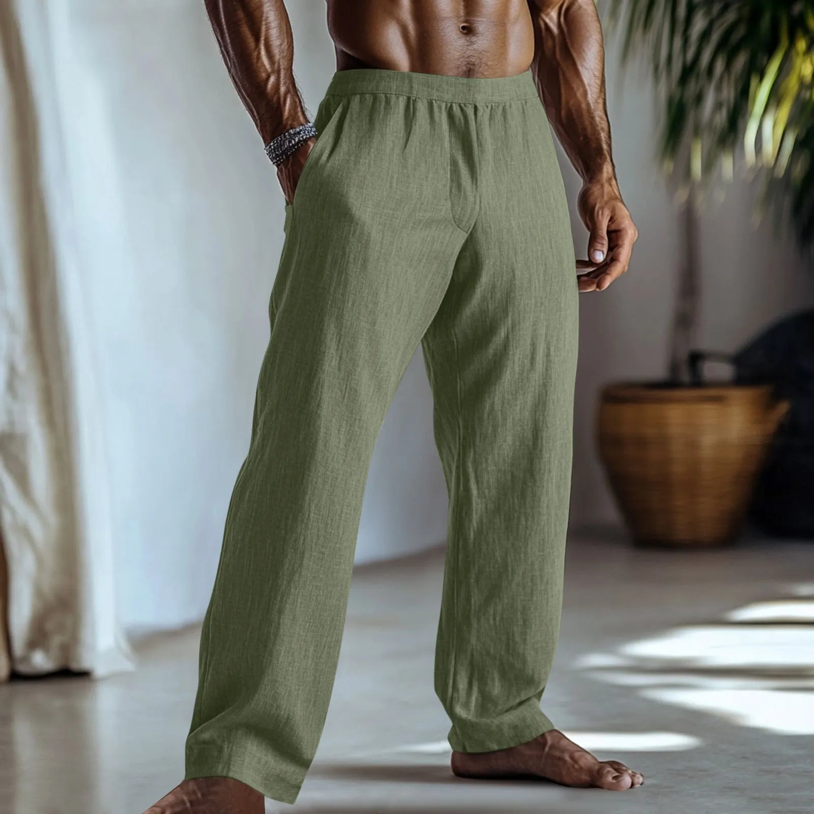 Straight-leg cotton linen trousers in light green on a hanger