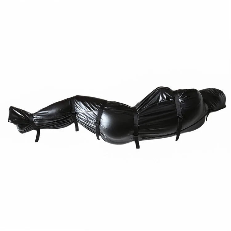 Black patent leather bondage garment with six ratchet tie-down straps for adult restraint