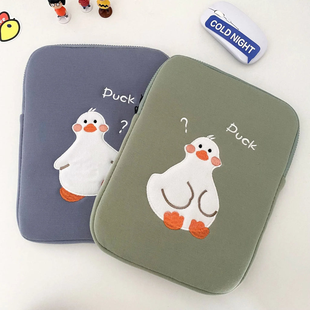 Blue cotton tablet case with an embroidered cartoon duck design and a silver zip closure.
