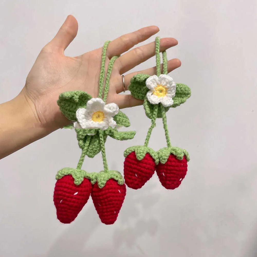 Handmade woven strawberry-shaped car pendant made from cotton and hemp knitting wool.
