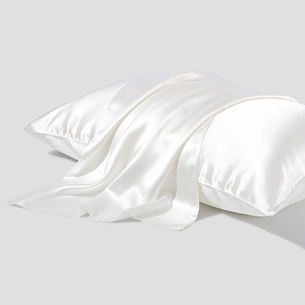 Dark grey silk pillowcase with envelope closure shown folded to display fabric texture