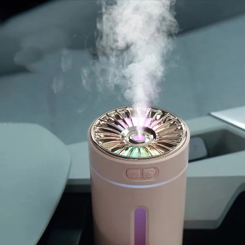 Black wireless portable humidifier with colourful lights beside car cup holder