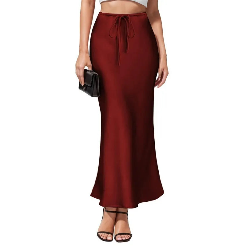 Asymmetric acetate satin skirt with irregular stitching details in high waist design