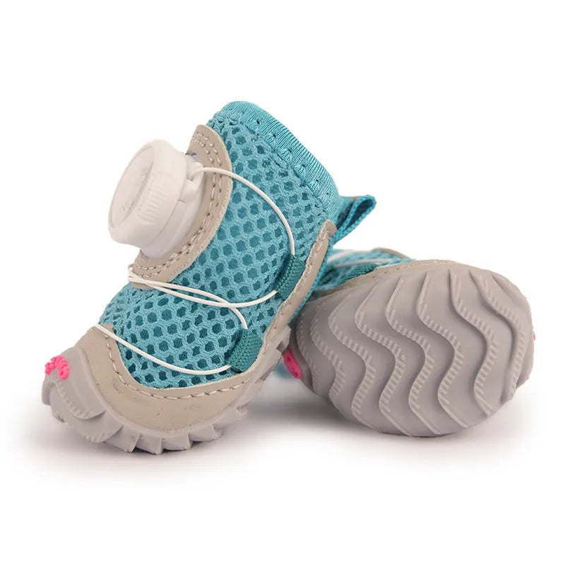 Soft bottom non-slip dog shoes in black with Oxford cloth upper, shown on a small dog