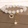 Handmade white cat's eye crystal bracelet with geometric Korean-style design.