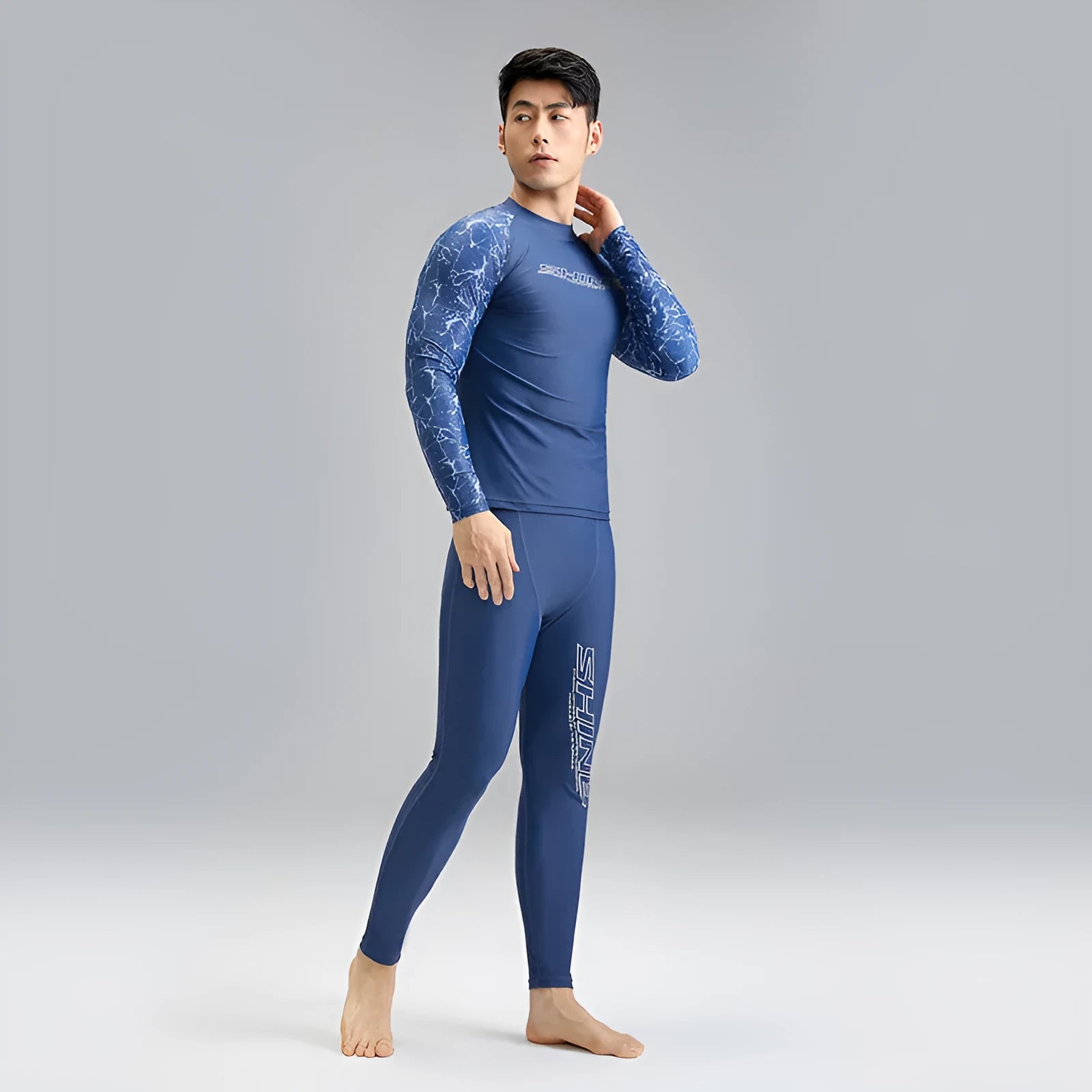 Men's dark blue patterned nylon swimwear set with matching top and trousers
