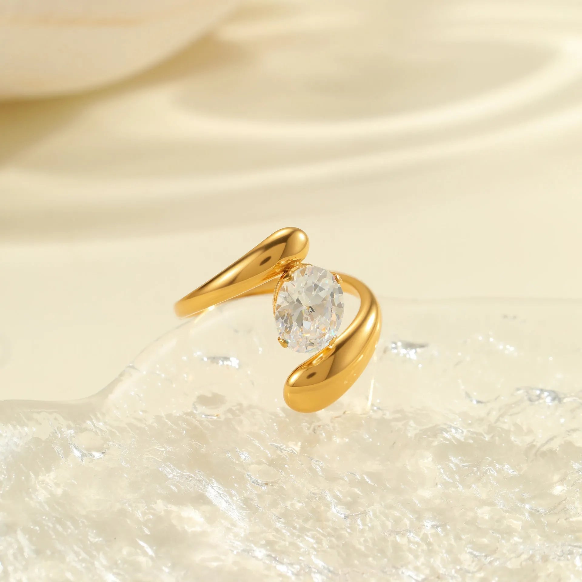 Geometric open mouth zircon ring in stainless steel with electroplated colour finish.