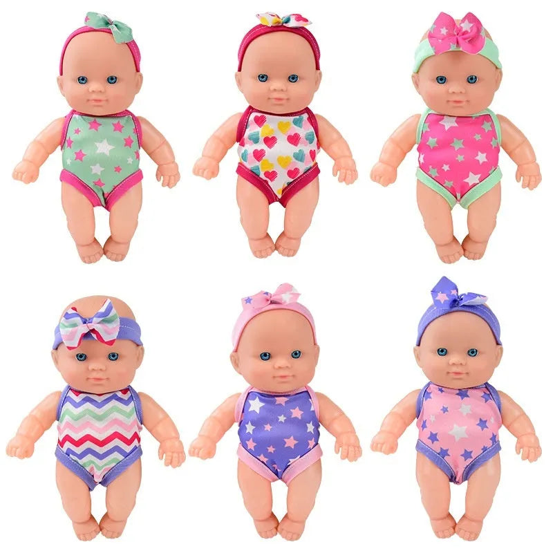 Vinyl baby figurine doll in presentation box, 21.5 cm tall, available in six colours.