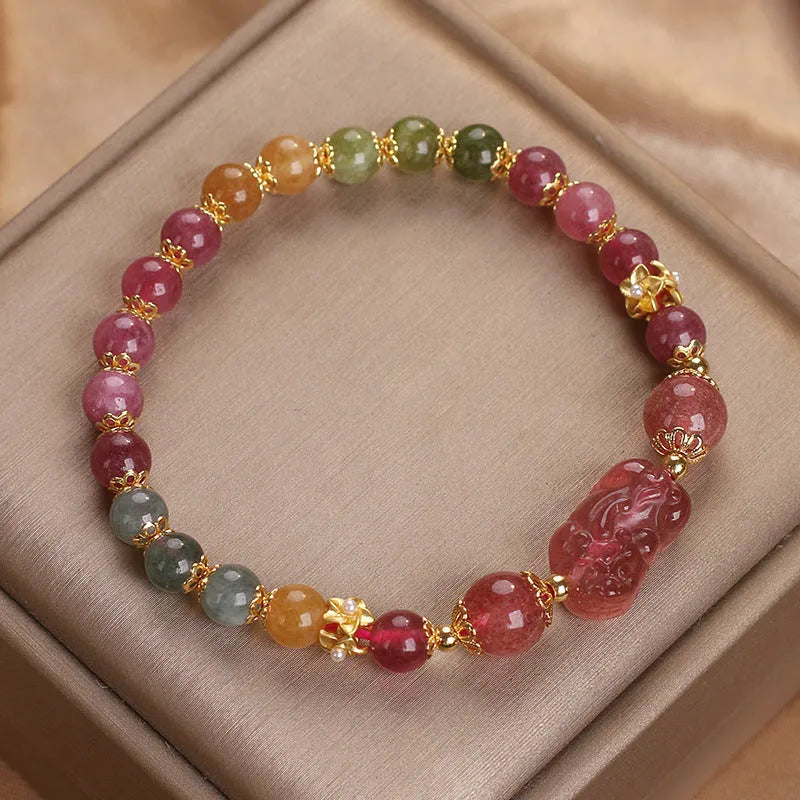Pink and red candy colour crystal bracelet with tourmaline and strawberry quartz stones, 17 cm length.