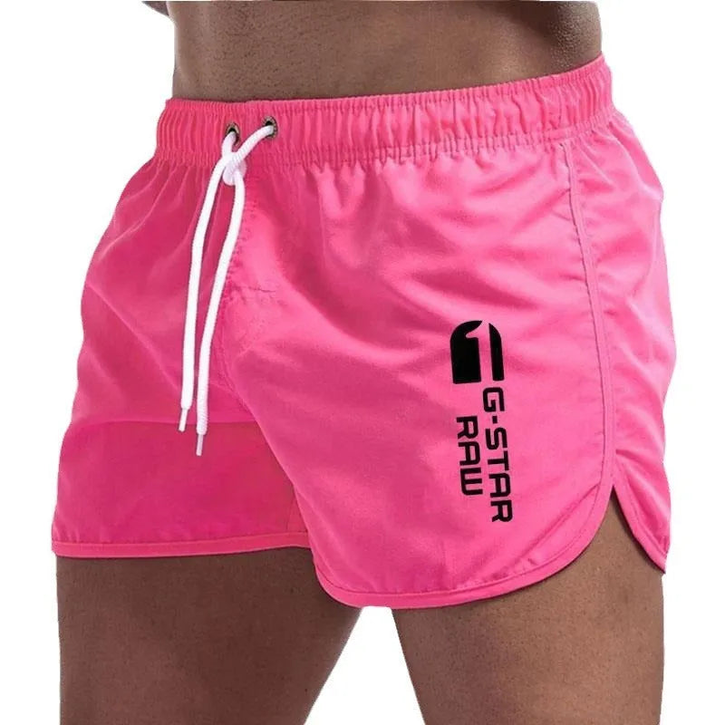 Men's thin polyester sports shorts in various colours with an elasticated waistband.