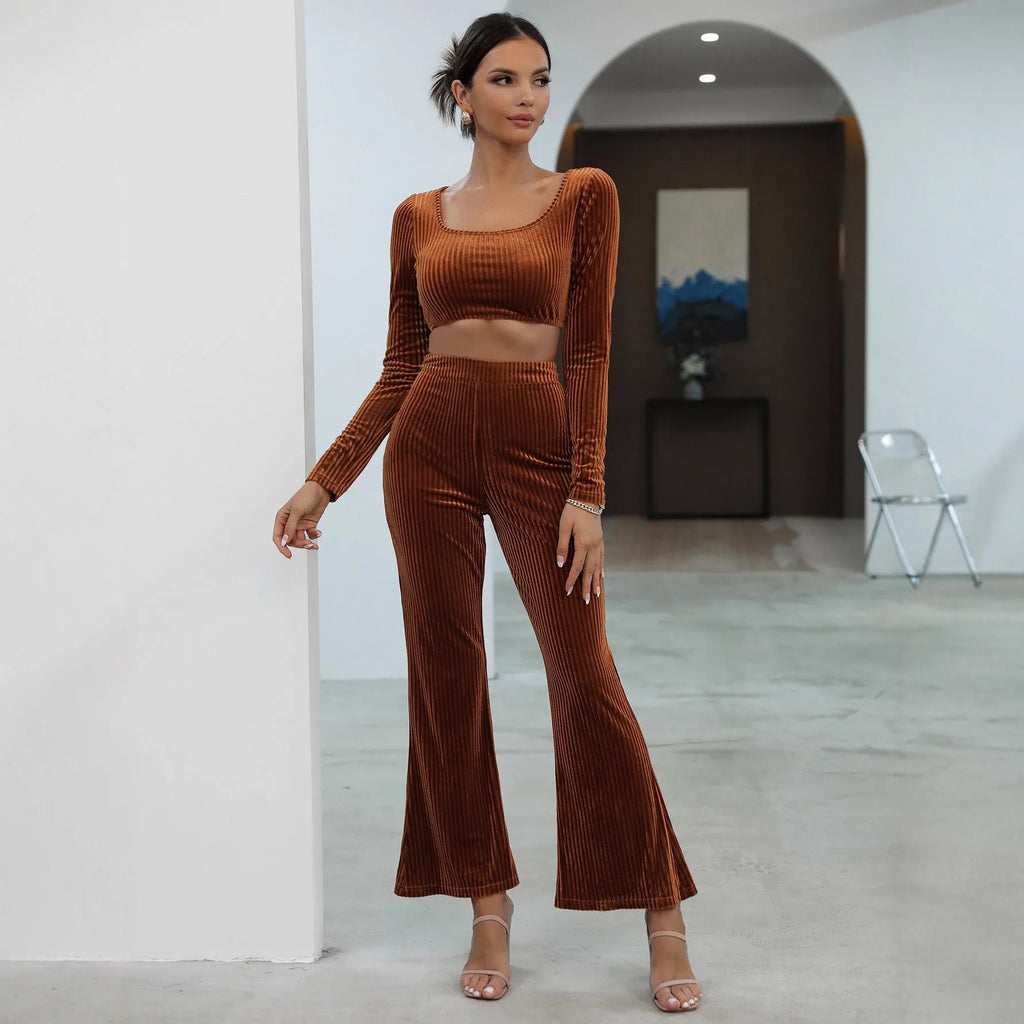 Caramel coloured long sleeve sweater and trousers co-ord set on a hanger