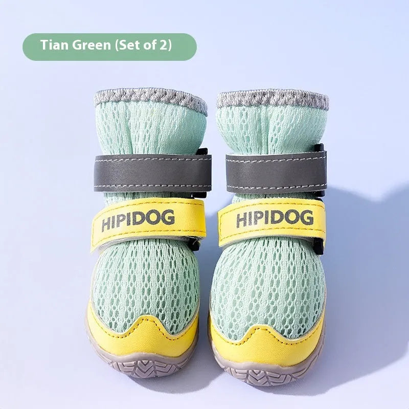Pair of light blue cartoon-style dog shoes with breathable PU material on a white background.