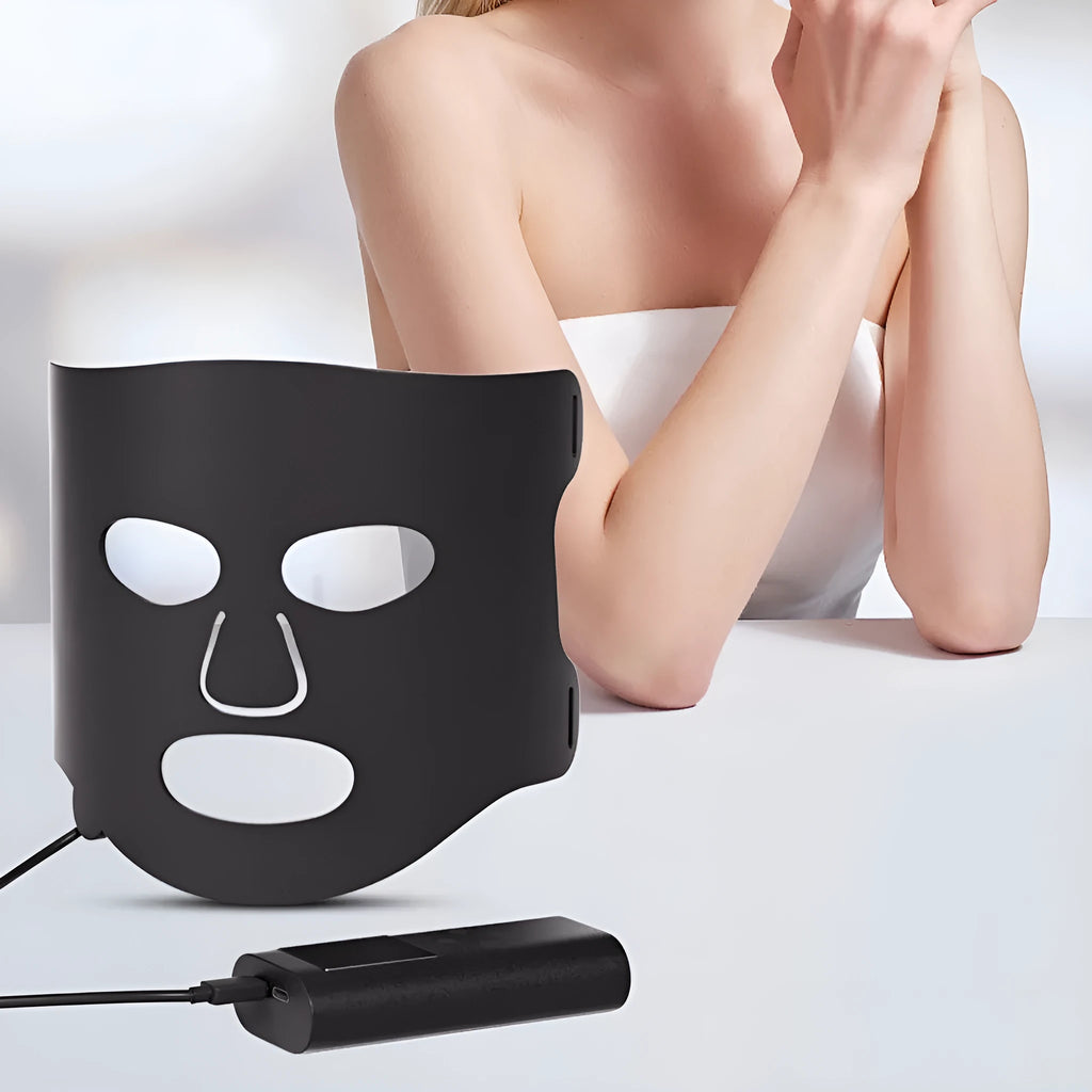 Black and white LED phototherapy face mask device with controller for home skin light therapy.