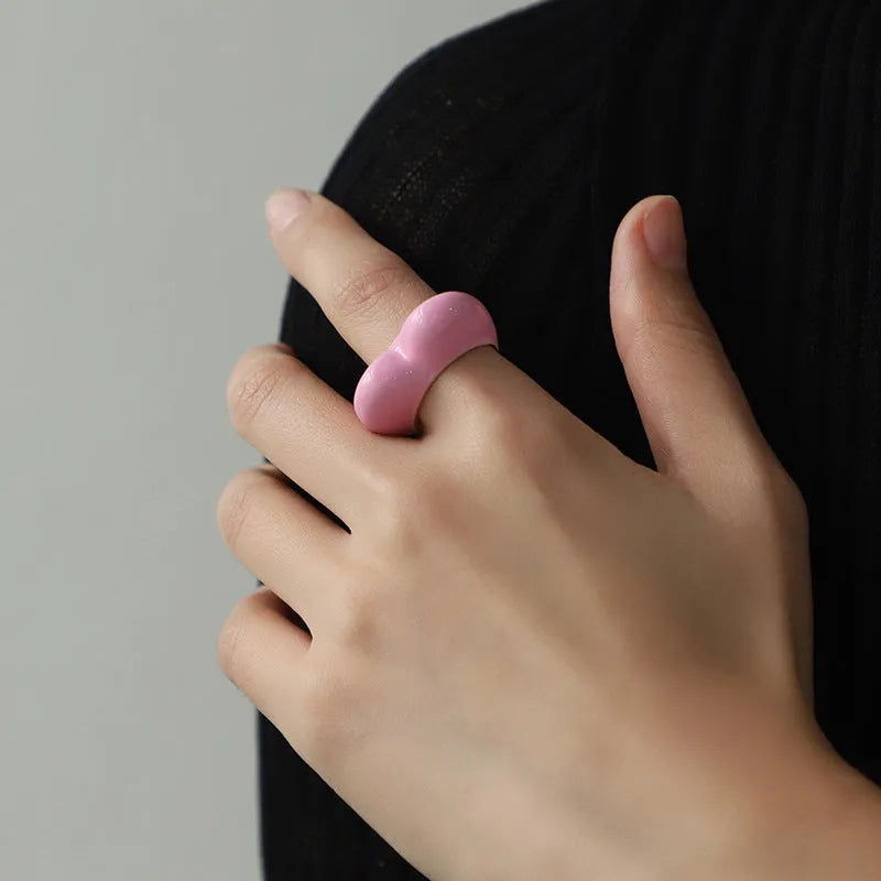 Colourful three-dimensional heart-shaped enamel ring made from zinc alloy, shown in red.