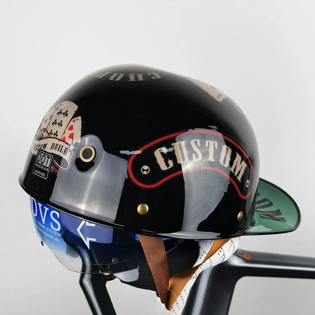 ABS motorcycle helmet in Black Feather design with blue lens visor, side view