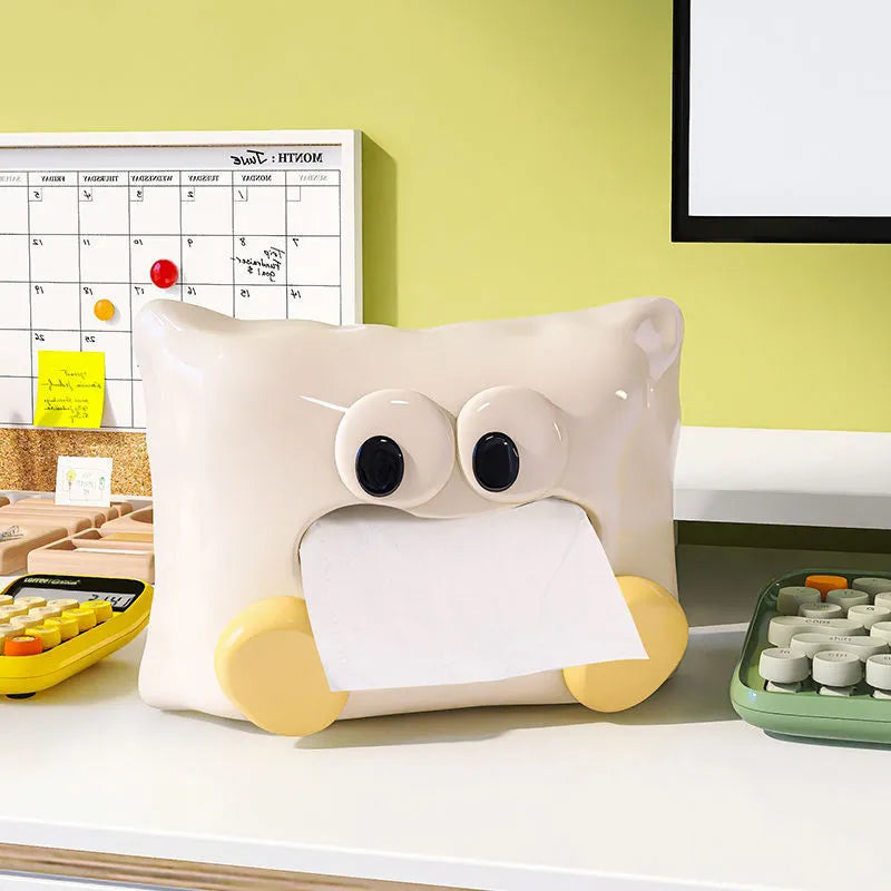 White ceramic tissue box holder with glazed finish on coffee table