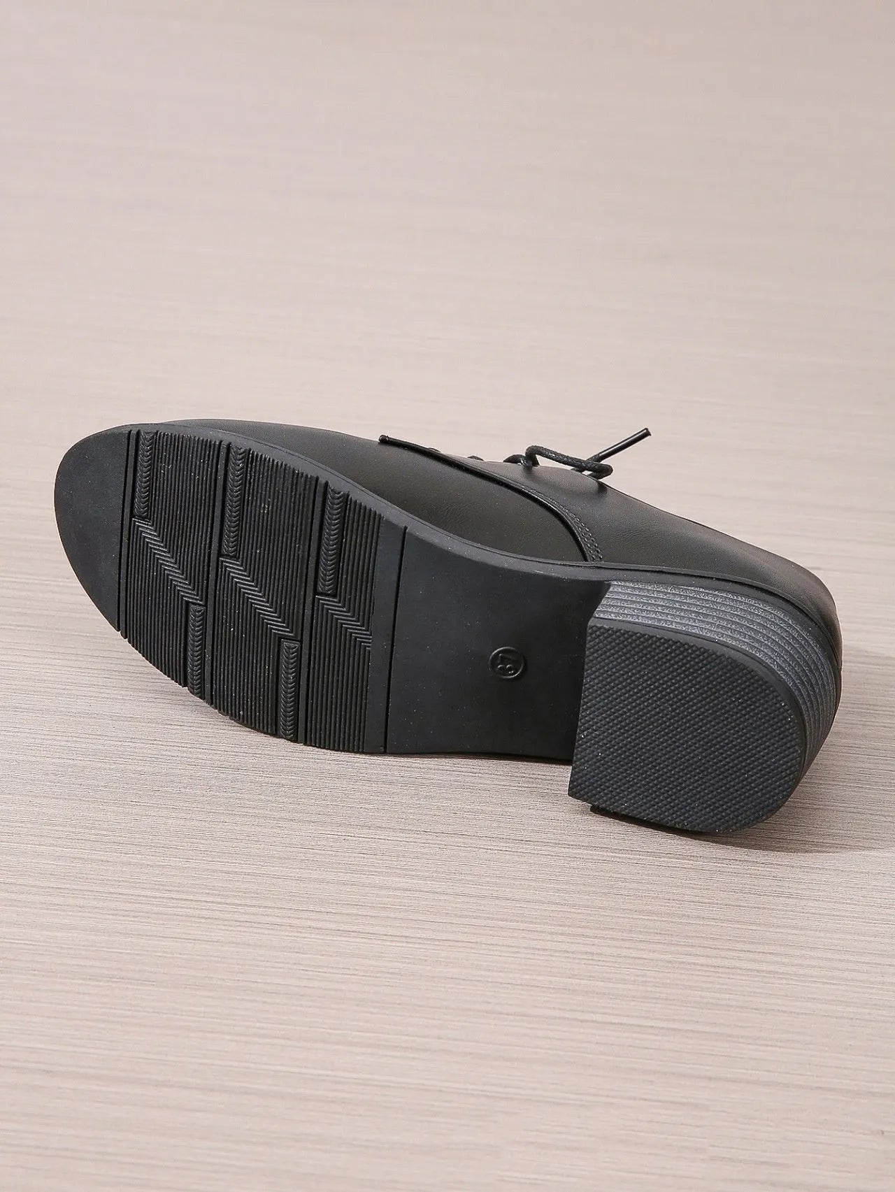 Black women's professional work shoes with chunky heel and low top design