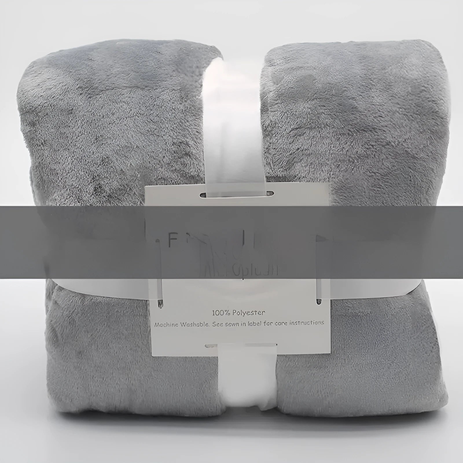 Light gray coral flannel polyester air conditioning blanket folded on a neutral background