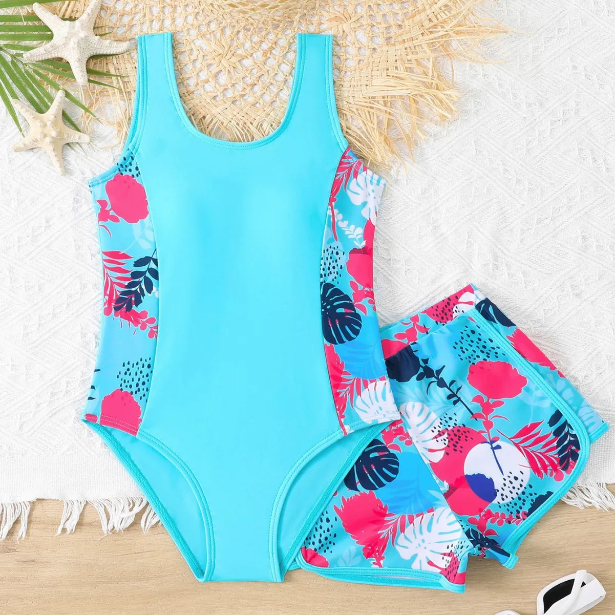 Girls two-piece swimsuit set with one-piece top and boxer shorts in purple, blue, and rose red