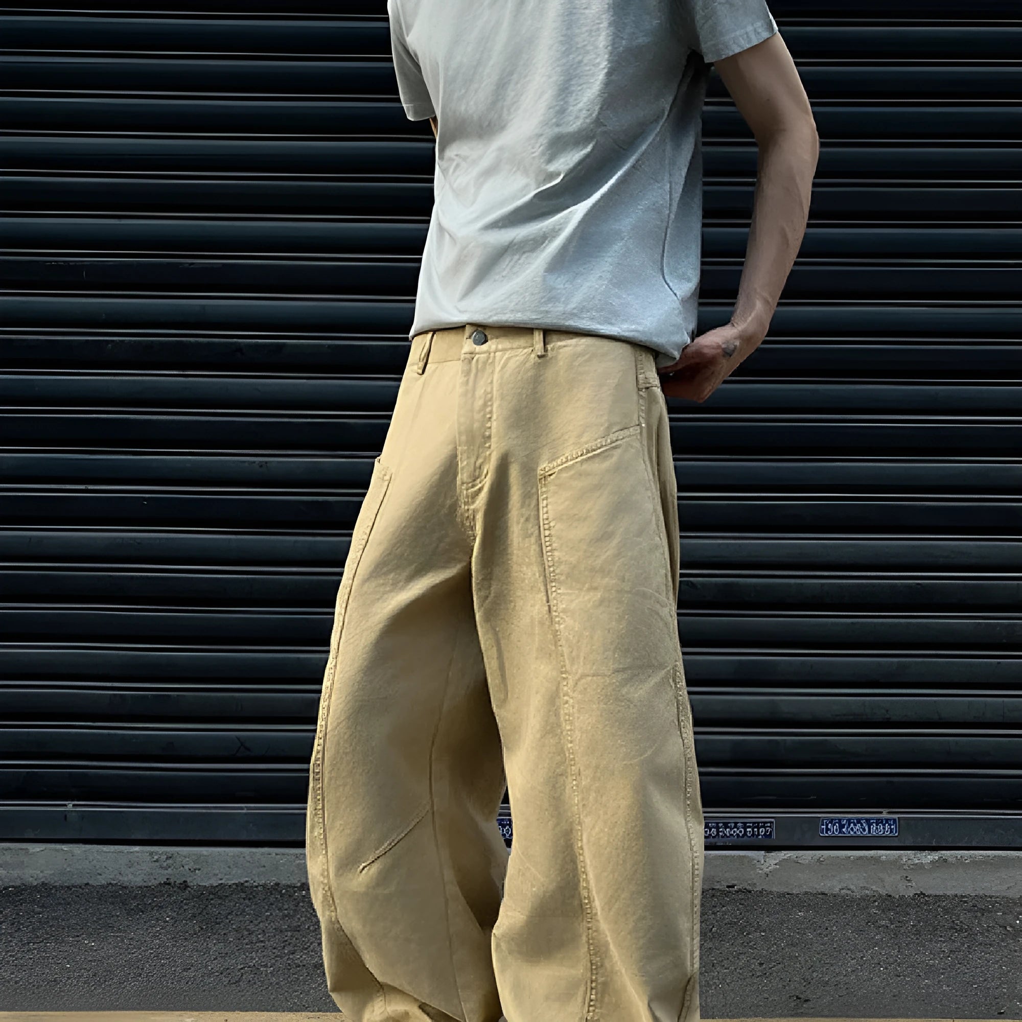 Khaki coloured men's straight leg cotton trousers on a white background