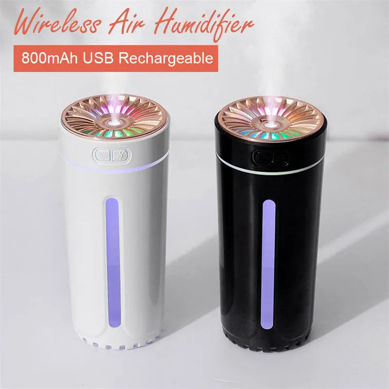 Black wireless portable humidifier with colourful lights beside car cup holder