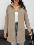 Grey loose-fit women's mid-length cardigan coat with pockets on a hanger.
