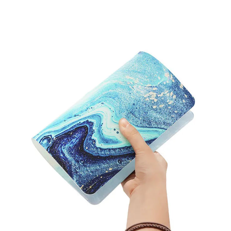 Custom painted hard plastic shell case for MacBook in black colour on a laptop