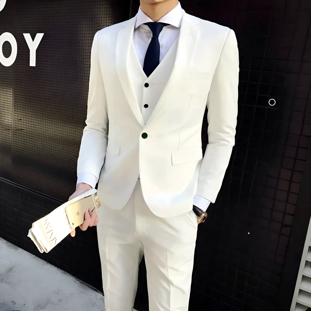 Men's white slim fit cotton blend suit set with jacket, vest, and trousers on a hanger