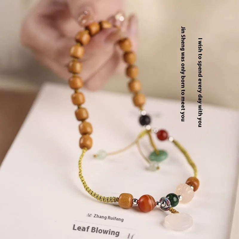 Hand-woven ebony double ring bracelet for women in national style with Ruyi motif.