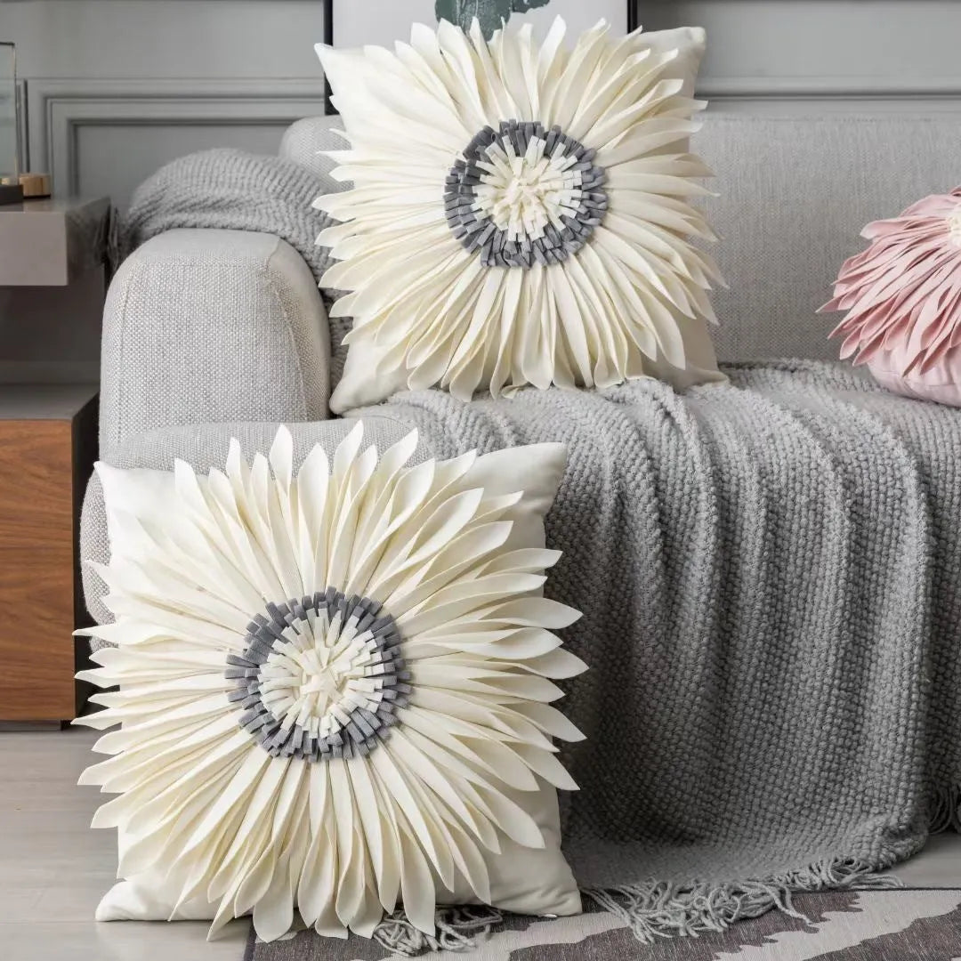 White polyester velvet cushion cover with blue chrysanthemum tufting pattern and fringed hem on a sofa